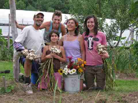 Daniel, Aaron, Divya, Ella and Leylee pose with garlic