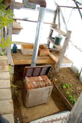 wood stove in hoophouse